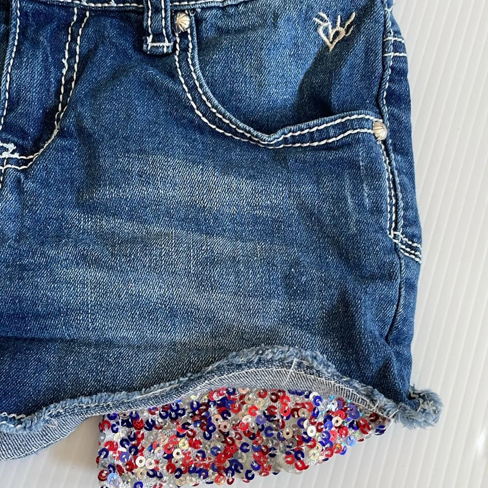 Justice denim jean shorts with red, blue & silver sequins. Girls size 10